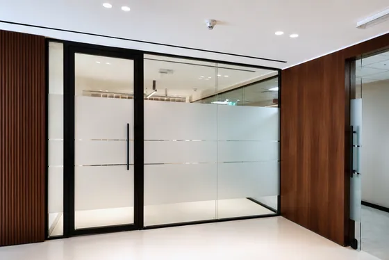 Glass office partition with privacy band, Juma Al Majid Group
