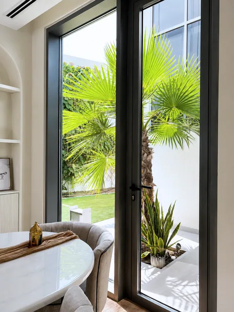 Dining nook with tall glazed door, Sidra Dubai Hills